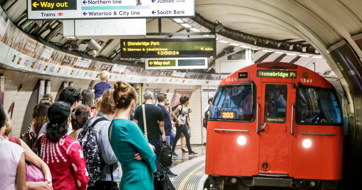Commuters crowding the concourse at London Euston station during travel disruption
