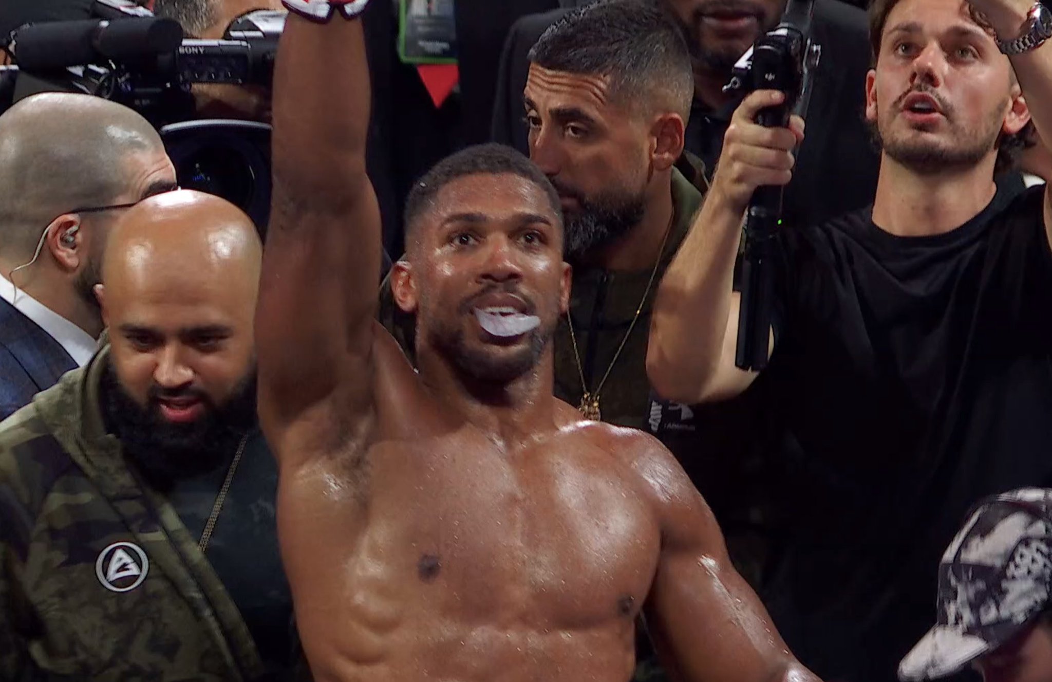 Anthony Joshua celebrates after defeating Jake Paul in Miami on Netflix