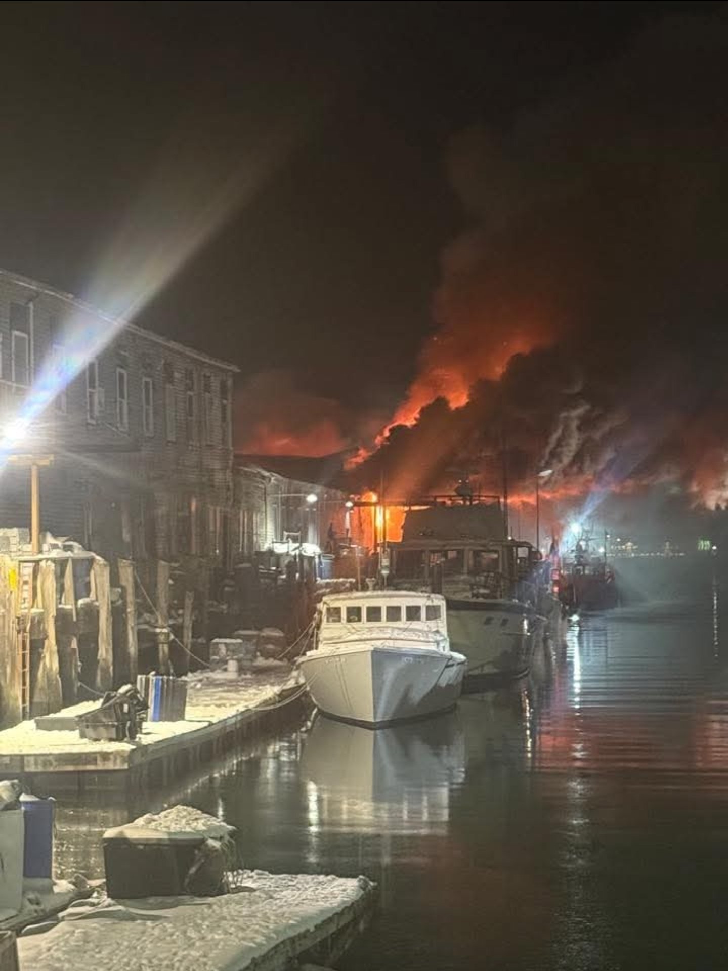 Fire crews respond to a three-alarm blaze at Portland’s historic Custom House Wharf in the Old Port.