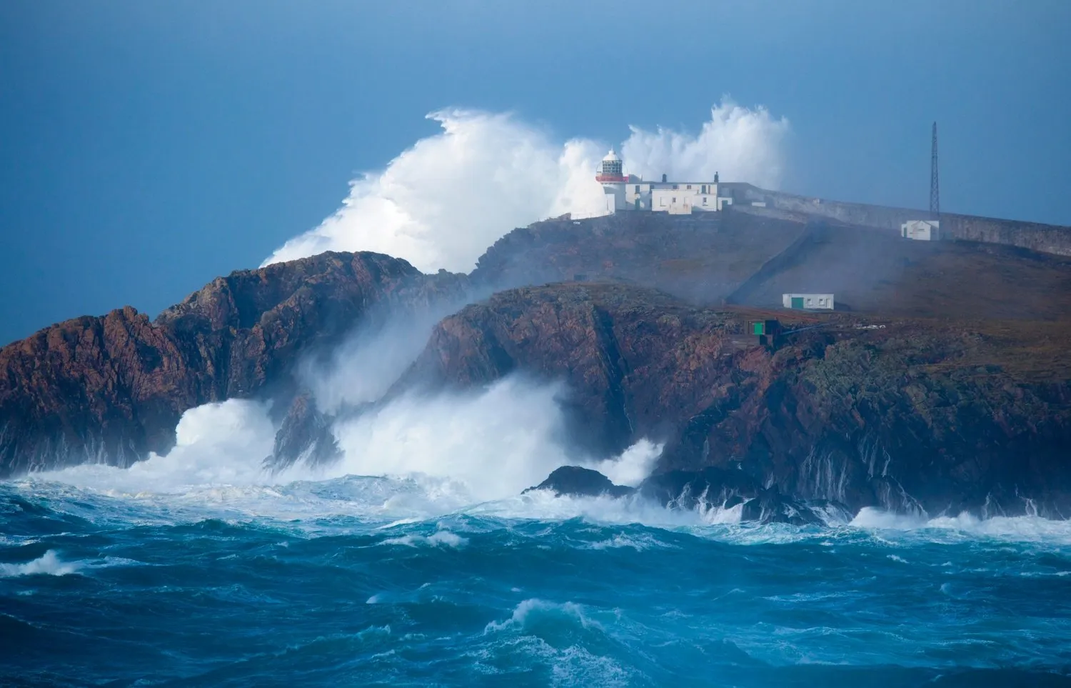 Powerful storm waves crashing against the Irish coastline during severe weather conditions