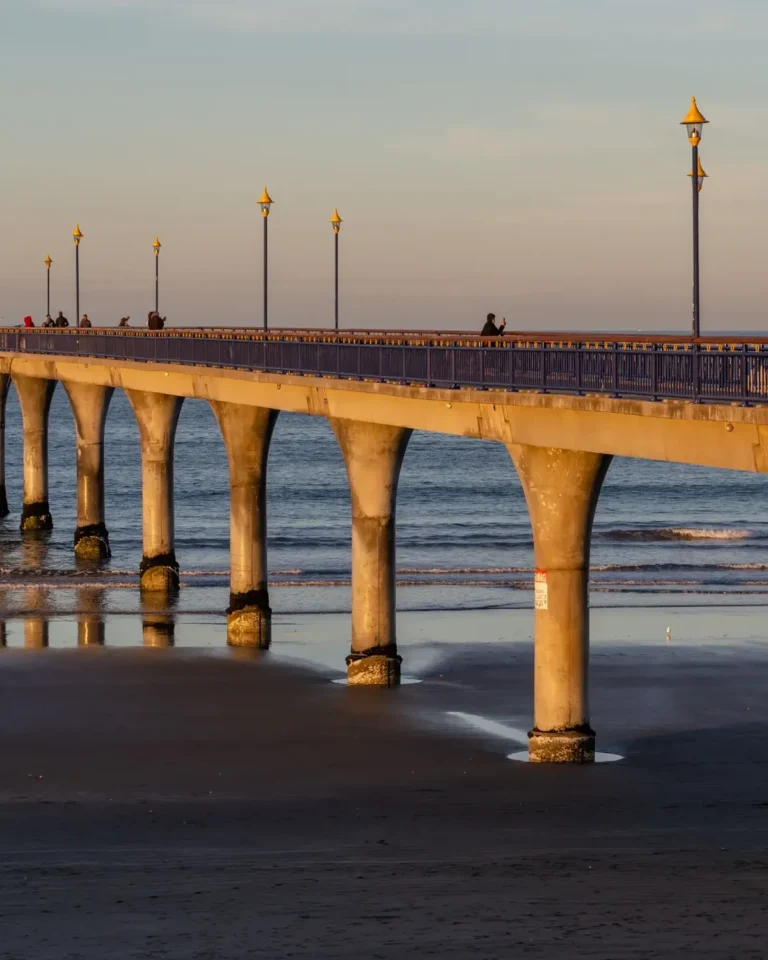 New Brighton Pier in Christchurch under clear skies during warm summer conditions