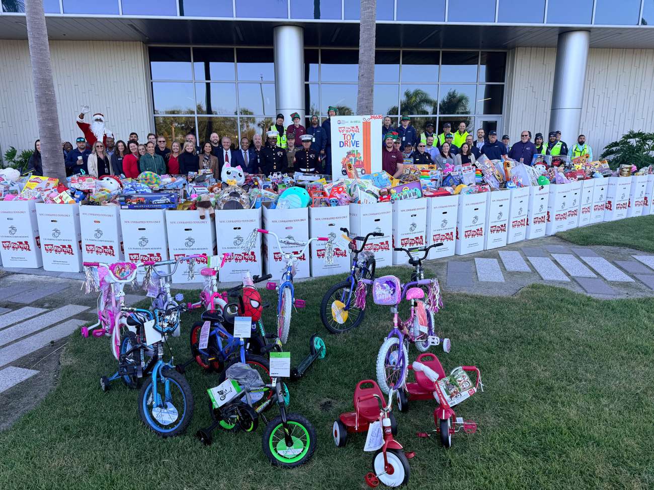 U.S. Marines and community volunteers gather with donated toys during a Toys for Tots drive in the Lowcountry