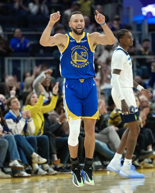 Steph Curry reacts after hitting a deep shot during warmups at Chase Center