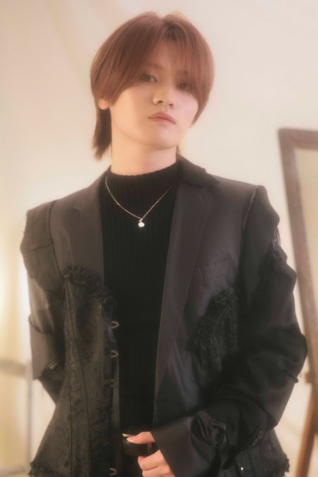 MAZZEL member TAKUTO performing on stage