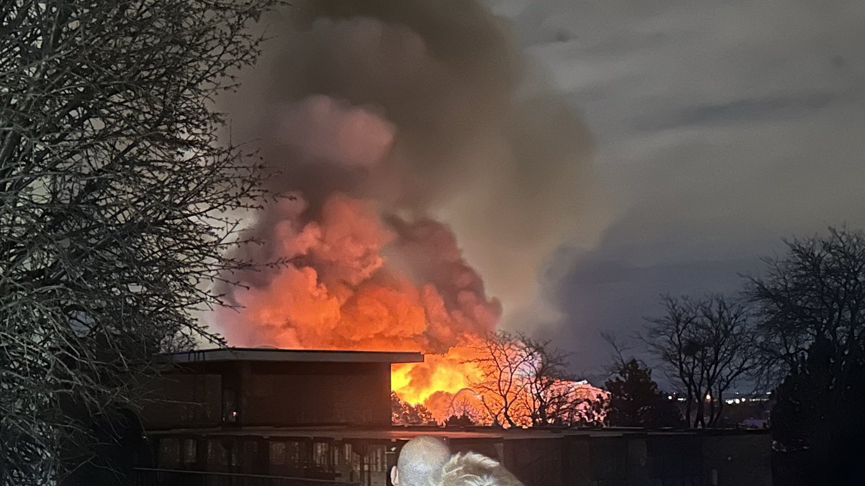 Flames and smoke rise from a three-alarm fire at a construction site in Denver
