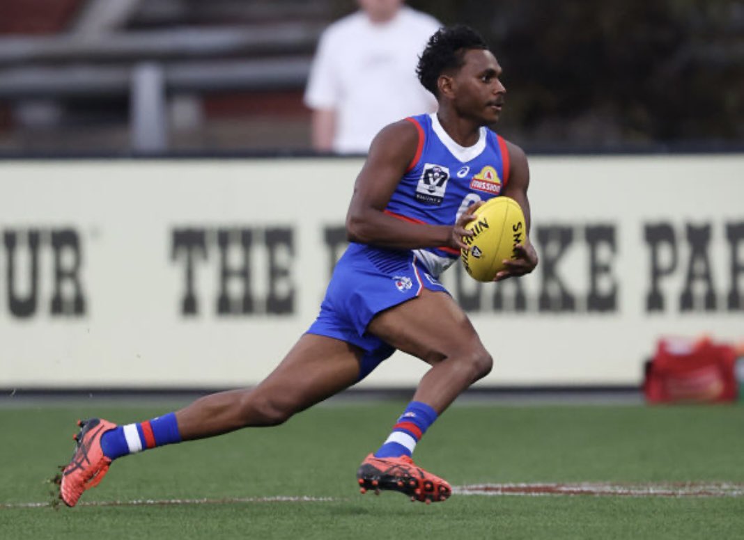 Tributes flow for former North Melbourne player Phoenix Spicer