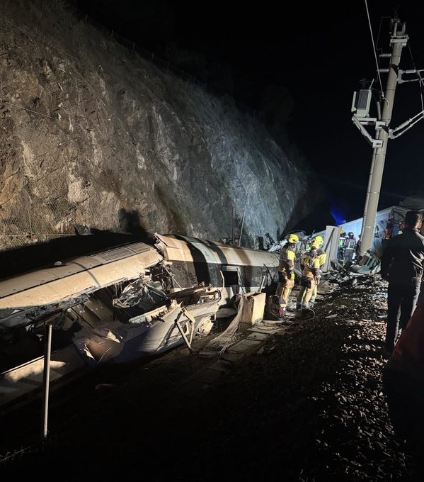 Emergency responders at the scene of a train derailment in southern Spain near Adamuz