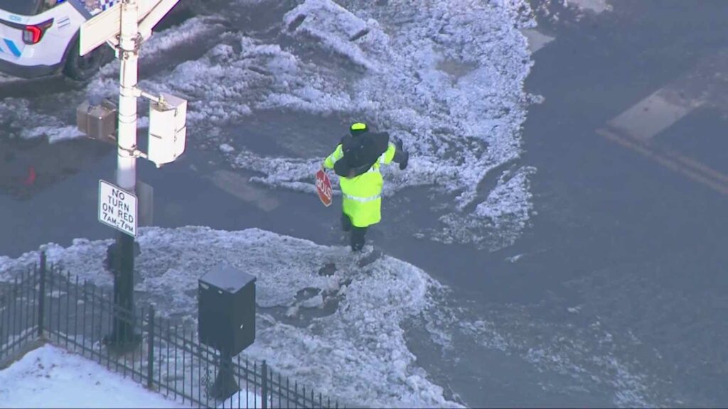 Chicago Crossing Guard Praised After Carrying Child Across Flooded Street in Freezing Weather
