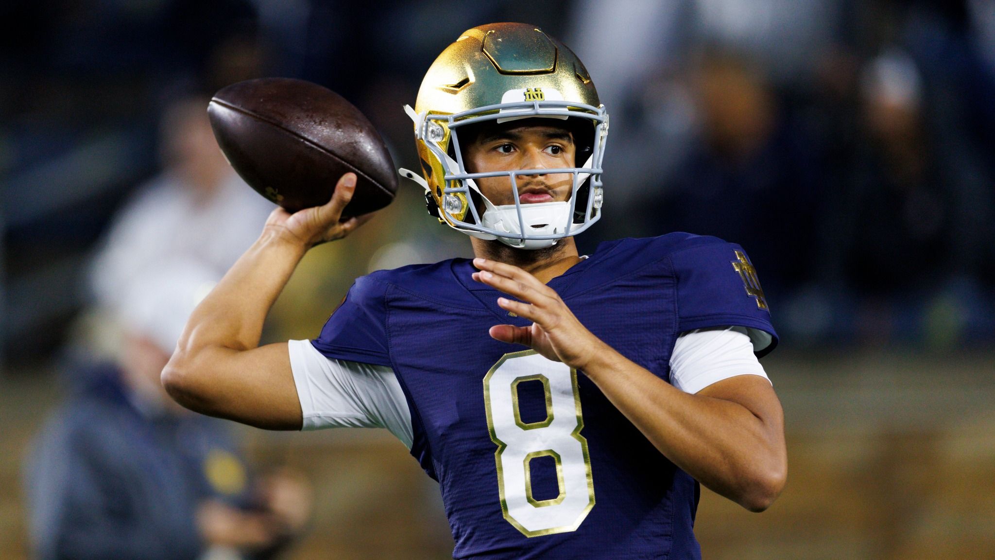 Kenny Minchey in Notre Dame uniform warms up before a game