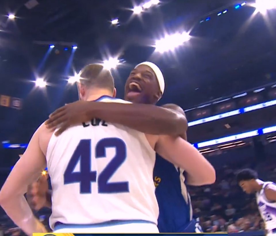 Kevin Love and Jimmy Butler share an embrace during Warriors vs Jazz game