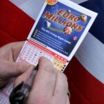 EuroMillions lottery draw anticipation with ticket and draw balls