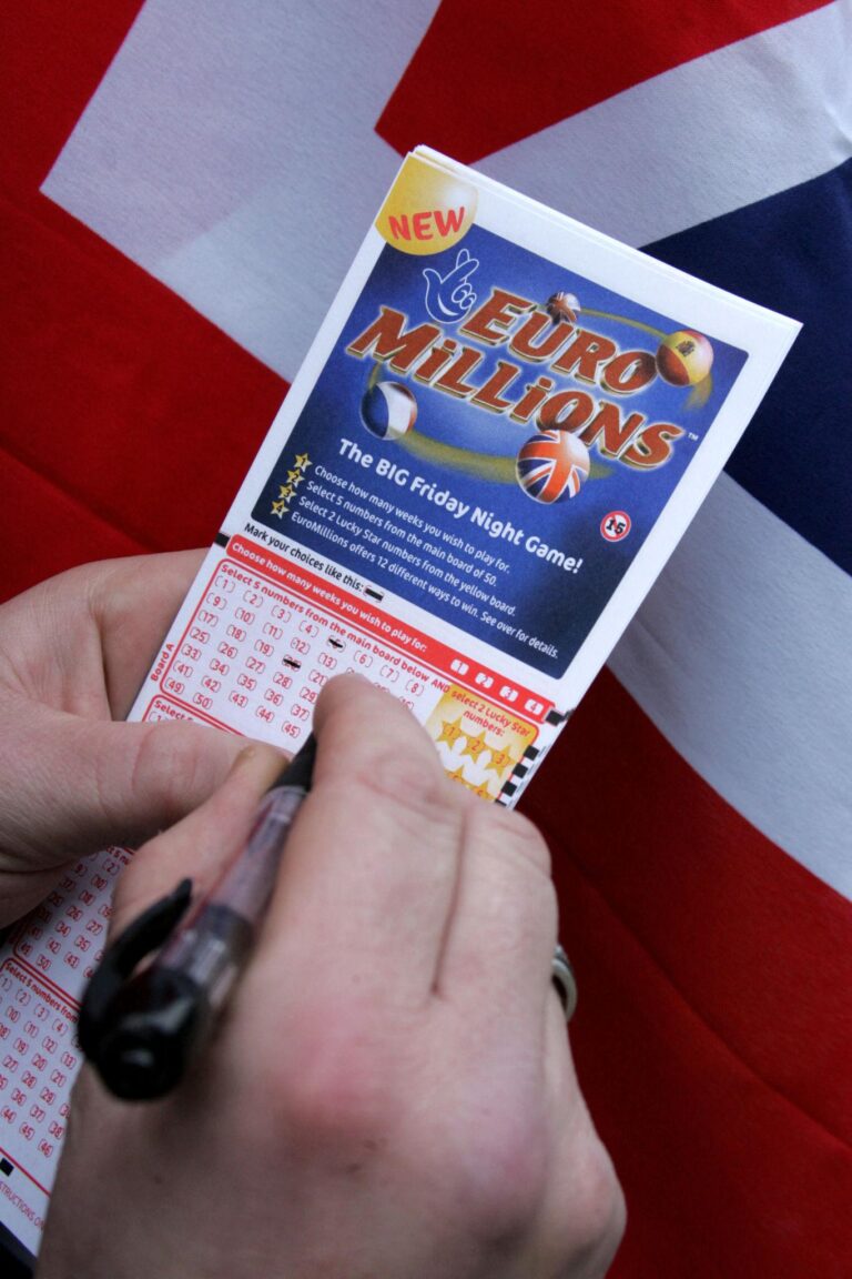 EuroMillions lottery draw anticipation with ticket and draw balls