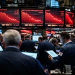 Wall Street traders monitor falling stock charts as Dow, S&P 500 and Nasdaq slide after hot PPI inflation data