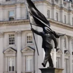 Banksy’s ‘Blinded by Flag’ Statue Installed Overnight in London as Crowds Gather