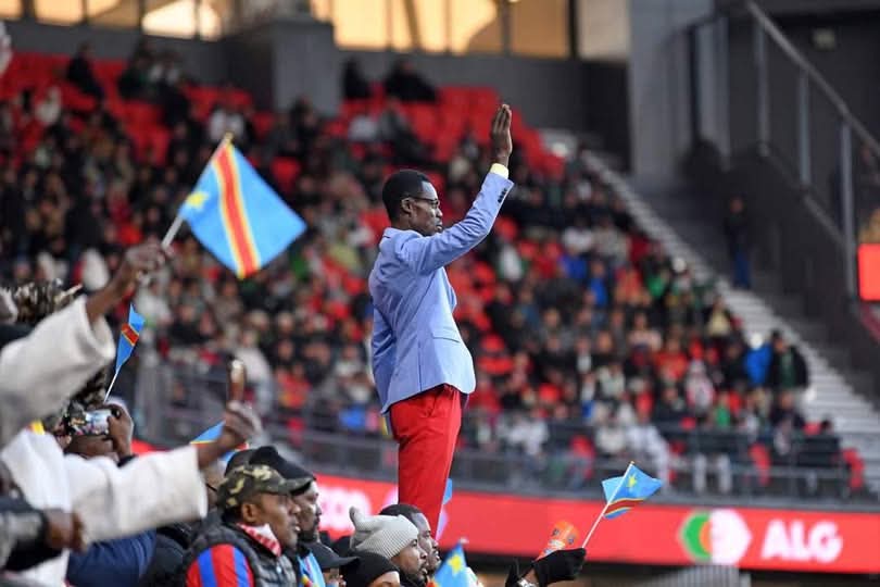 DR Congo statue fan Lumumba Vea standing still in the crowd
