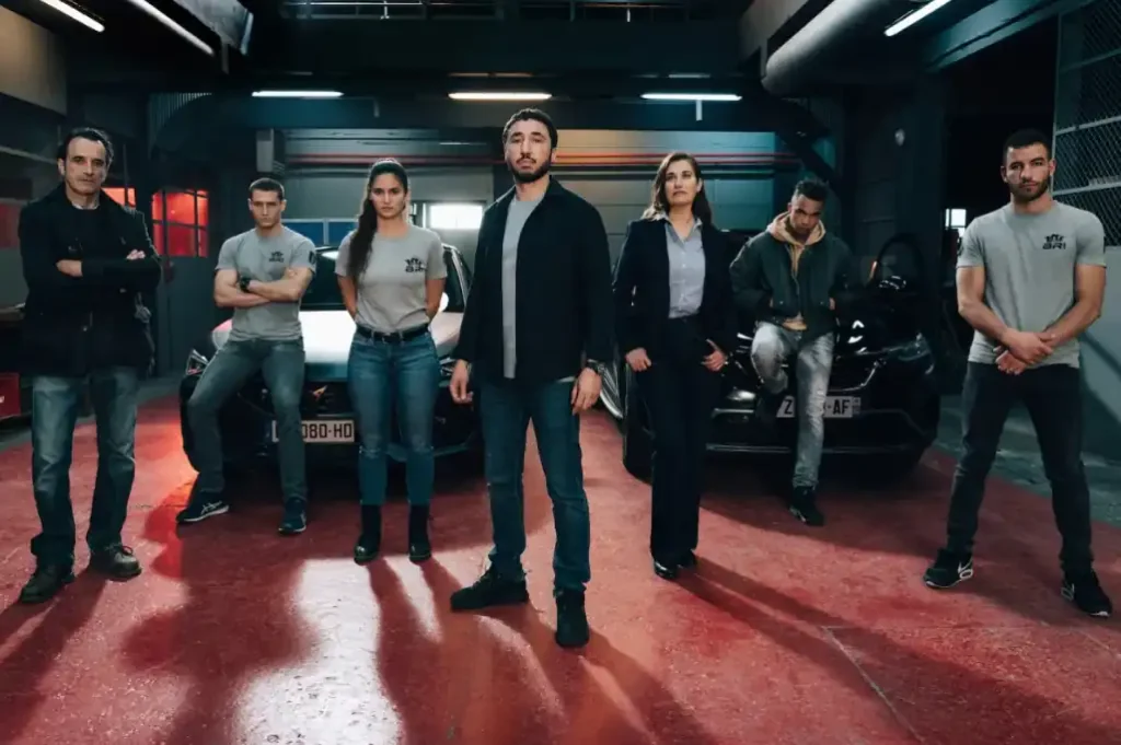 Bosch: Legacy Season 3 cast members stand inside a police garage ahead of the final season premiering on SBS On Demand on July 2, 2026.
