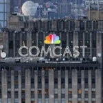 Comcast headquarters in New York City displaying the Comcast logo as the company announces plans to split into two publicly traded companies and spin off NBCUniversal and Sky.