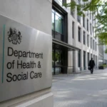 Department of Health and Social Care headquarters building sign representing the UK government's volunteer service assessor recruitment programme for digital health professionals