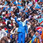 DR Congo statue fan Lumumba Vea standing still during a football match.