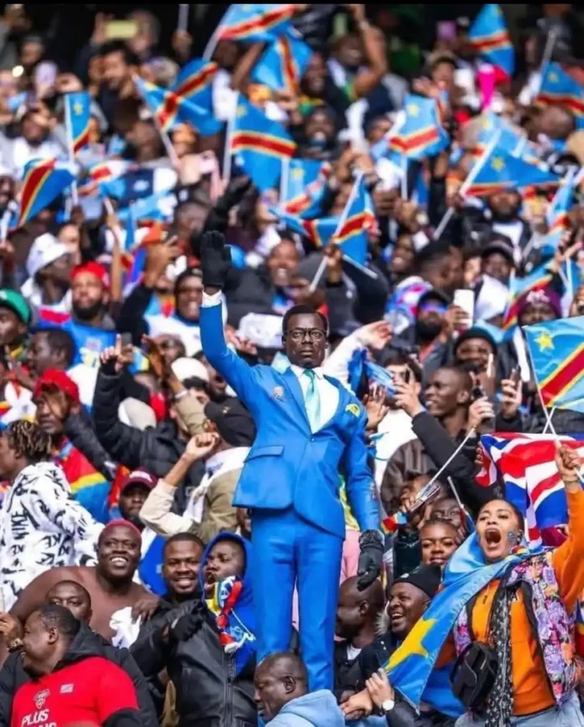 DR Congo statue fan Lumumba Vea standing still during a football match.