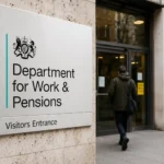 Department for Work and Pensions (DWP) office entrance sign in the UK, illustrating the government's new benefit debt recovery rules and driving licence enforcement powers introduced in 2026.