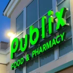 Publix Food & Pharmacy storefront exterior with illuminated green Publix signage on a modern grocery store building in Florida.