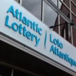 Atlantic Lottery Corporation office building with the company’s bilingual "Atlantic Lottery | Loto Atlantique" signage displayed outside its headquarters in Moncton, New Brunswick.