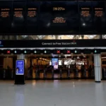 Electronic departure boards at London Charing Cross station display notices about the 22-day closure while the station entrance and ticket barriers remain largely empty ahead of the £20 million railway upgrade.