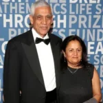 Vinod Khosla and Neeru Khosla pose together at a formal event wearing evening attire in front of a Breakthrough Prize Foundation backdrop.
