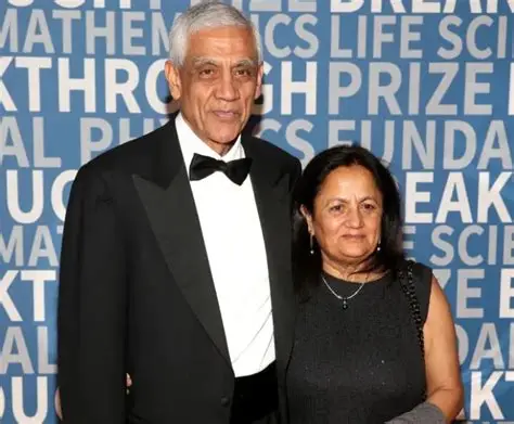Vinod Khosla and Neeru Khosla pose together at a formal event wearing evening attire in front of a Breakthrough Prize Foundation backdrop.