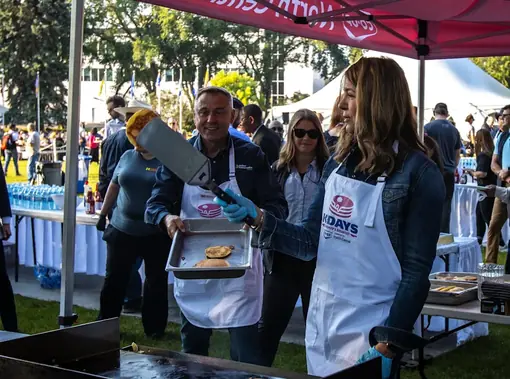 Alberta Premier Danielle Smith serving pancakes at the Alberta Legislature in Edmonton.