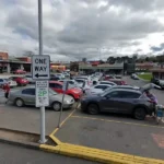 Cars parked in a shopping centre car park in Drouin, Victoria, where Baw Baw Shire Council announced refunds for drivers overcharged on certain parking fines