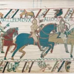 Bayeux Tapestry showing Norman horsemen and medieval embroidered scenes depicting the events leading to the Norman Conquest of England in 1066.