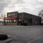 Hardee’s restaurant with an empty parking lot amid franchisee closures and bankruptcy restructuring in 2026.
