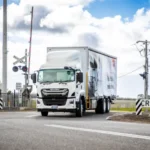 Isuzu F-Series truck undergoing a power-steering recall inspection in Australia