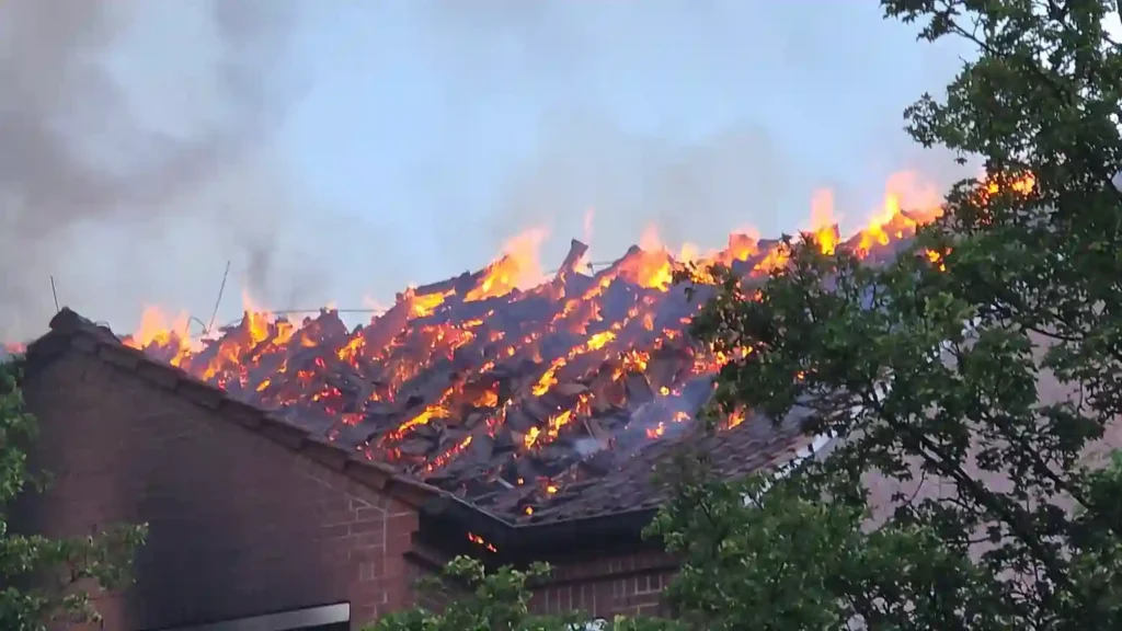 Roof engulfed in flames at Ludwigslust Hospital as firefighters battle the deadly blaze in Germany