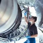 Aerospace technician inspecting a jet engine at a manufacturing facility amid the Magellan Aerospace Middletown Chapter 11 filing.