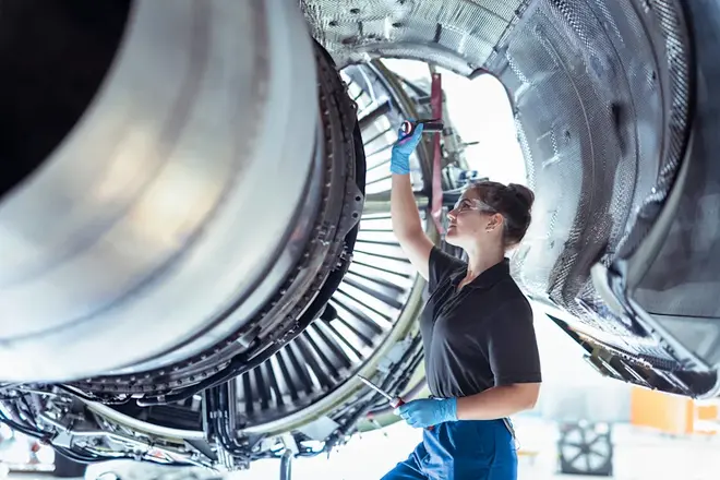 Aerospace technician inspecting a jet engine at a manufacturing facility amid the Magellan Aerospace Middletown Chapter 11 filing.
