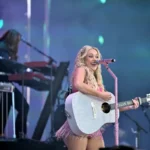 Megan Moroney pauses during her Denver concert at Ball Arena after becoming ill