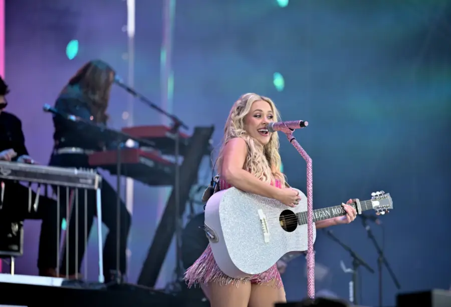 Megan Moroney pauses during her Denver concert at Ball Arena after becoming ill