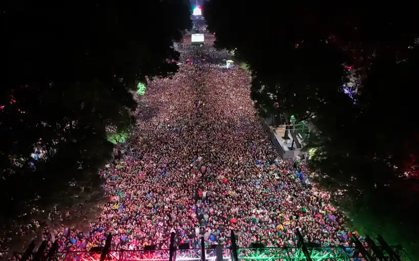 Massive crowd of Mexico fans celebrating at night after World Cup victory over Ecuador.