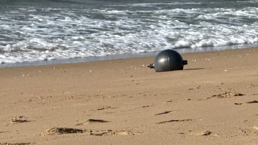 Suspected space debris resting on the sand at Forrest Beach in north Queensland as authorities investigate the mysterious objects
