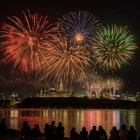Colourful Ottawa fireworks over the river during Les Grands Feux 2026