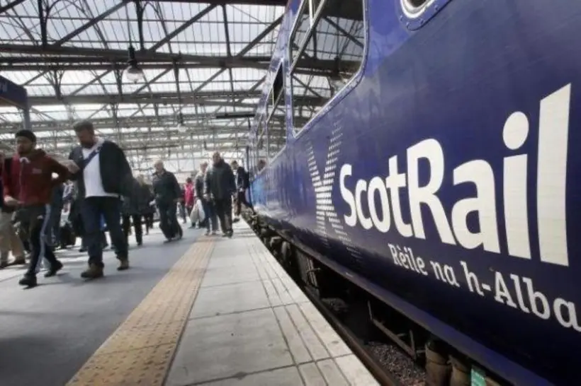 ScotRail train at a busy station as passengers experience problems with the new ticketing app.