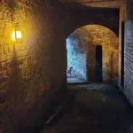 250-year-old underground brick tunnels at Stourbridge Glass Museum in England, showcasing the historic glassworks passage set to open to the public.