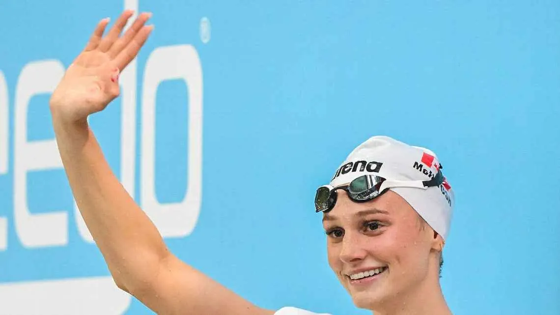 Summer McIntosh celebrates after breaking the 17-year-old women's 200m butterfly world record at the Canadian Swimming Trials in Montrea