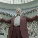 Tom Cruise as billionaire Digger Rockwell with dramatic aging makeup and outstretched arms addressing a large crowd in a scene from the Digger trailer.