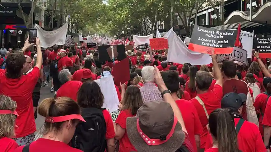 Victorian public school teachers and supporters march during a statewide strike in Melbourne ahead of the July 23 industrial action.