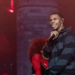 A Boogie Wit da Hoodie performing live on stage during a concert.
