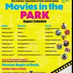 Families enjoy a free Movies in the Park outdoor screening in Atlanta during August 2026.